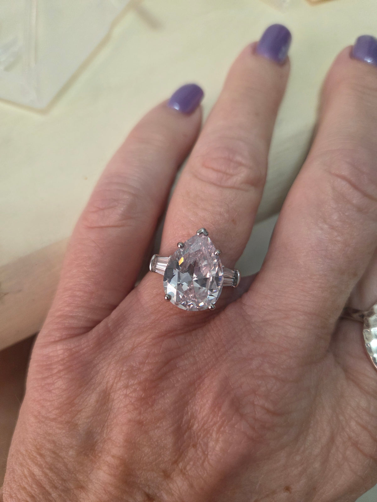 Gorgeous pear shaped with bagettes. Approx 5-6 carats.