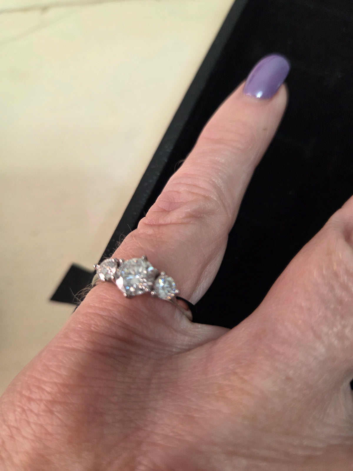 1 plus carat 3 stone moissanite ring set in sterling silver. Size 7 and 2 8s